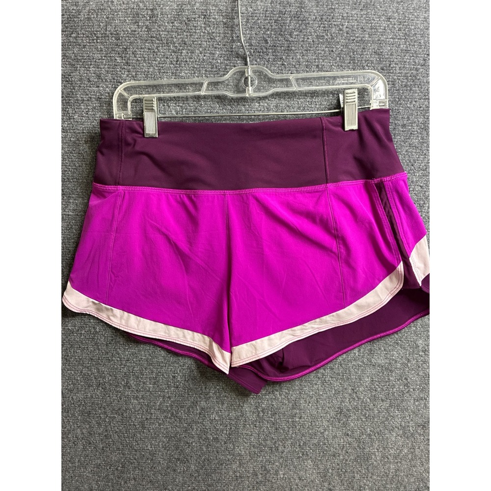 Athleta Be Free Purple Pink Colorblock Running Shorts Womens Small Zipper Pocket
